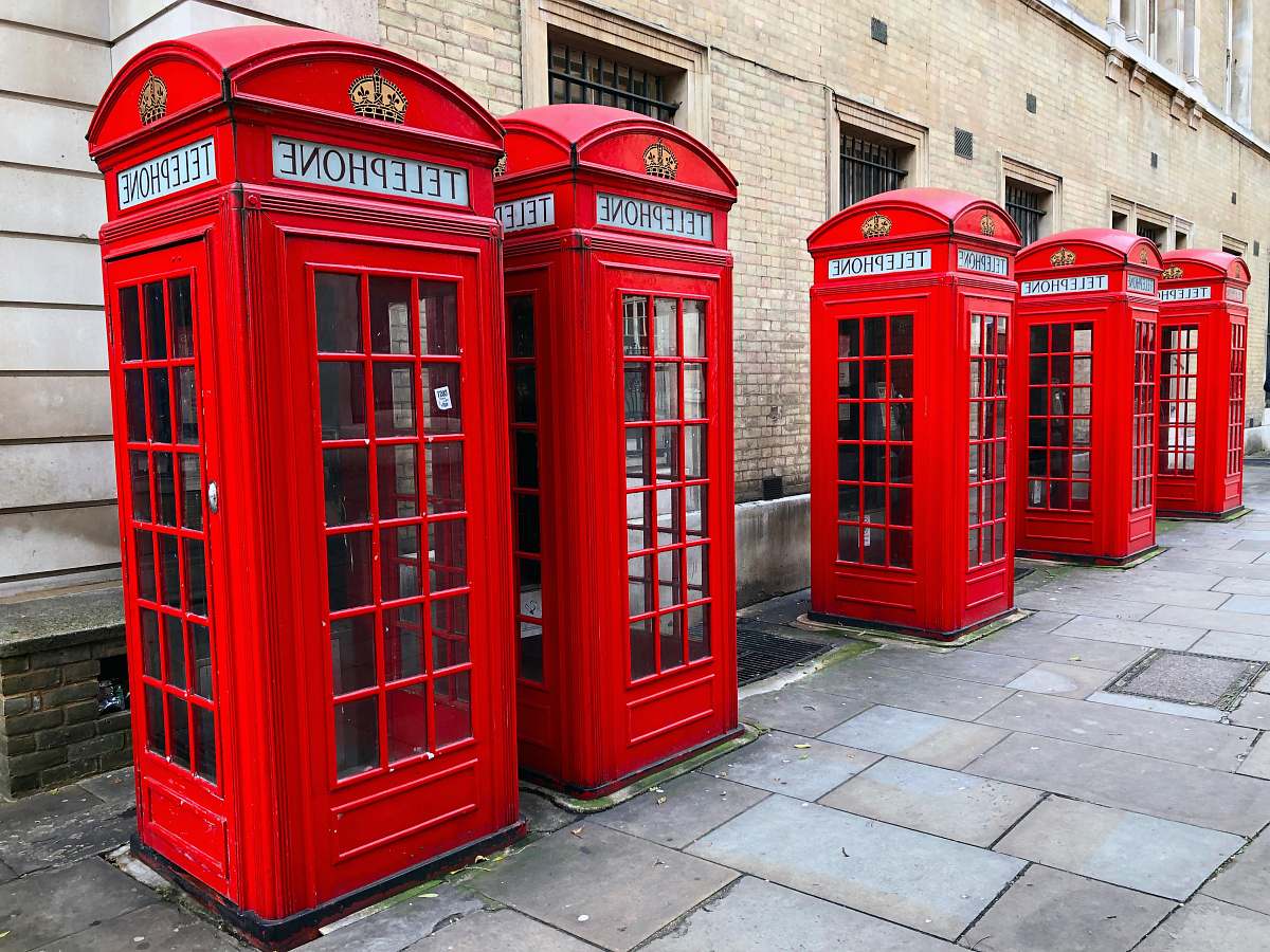 phone booth lined-up red telephone booths near building london